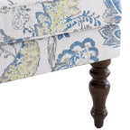 Sillón decorativo con patas torneadas y brazos redondos