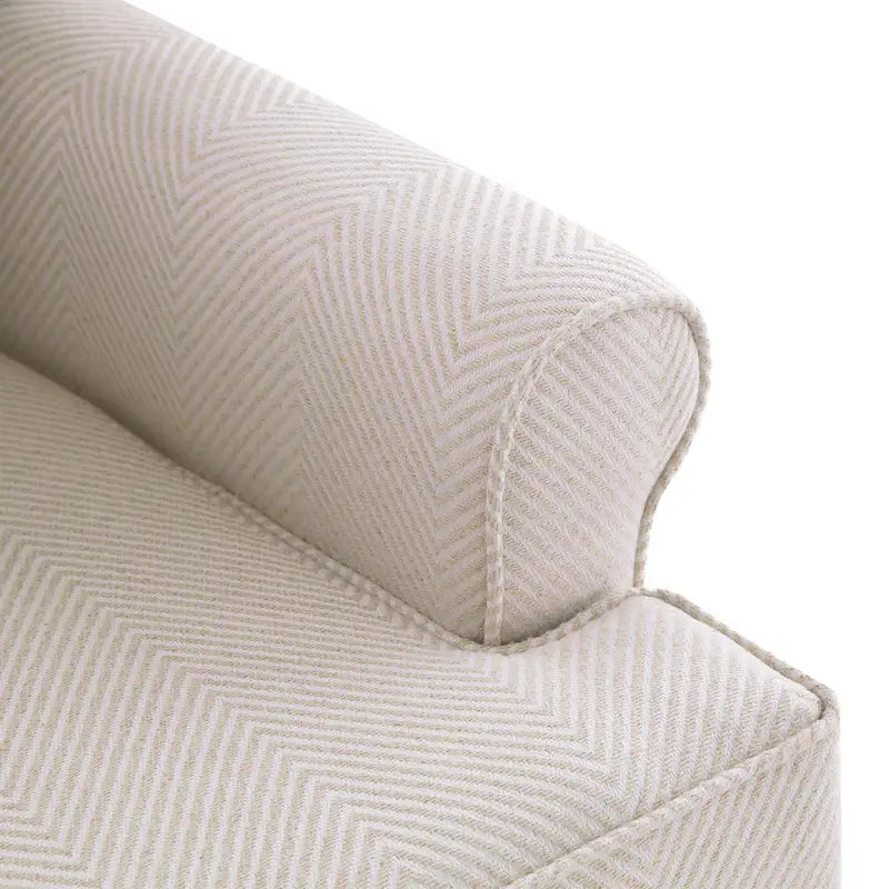 Sillón decorativo con patas torneadas y brazos redondos
