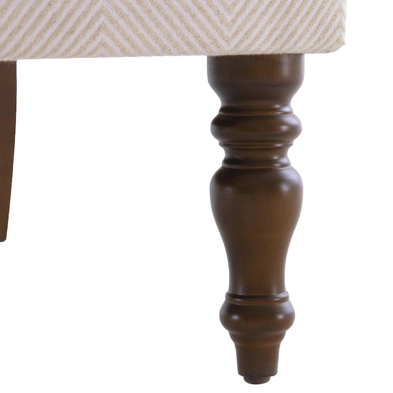 Sillón decorativo con patas torneadas y brazos redondos