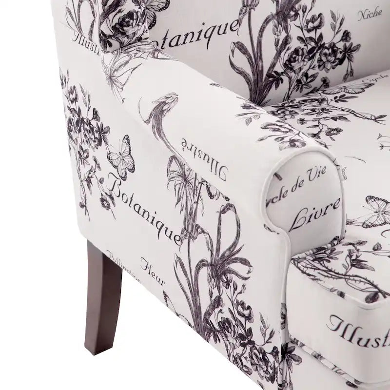 Sillón decorativo con patas torneadas y brazos redondos