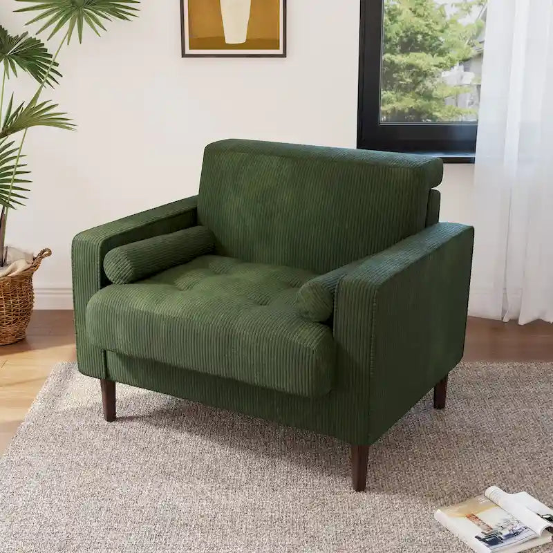 Sillón moderno tapizado de pana con brazos y cojines
