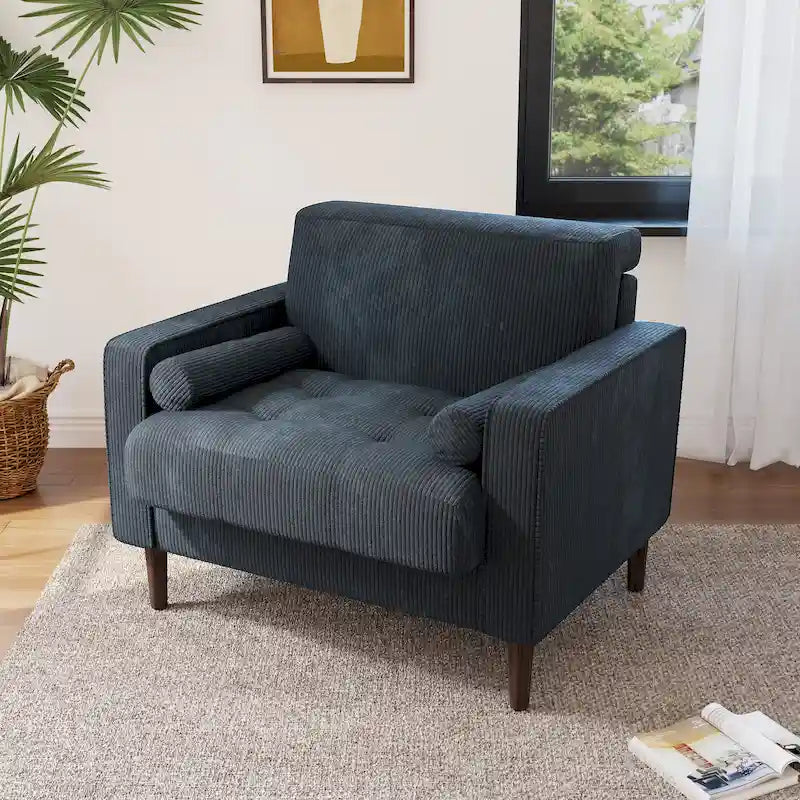 Sillón moderno tapizado de pana con brazos y cojines