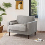 Sillón moderno tapizado de pana con brazos y cojines