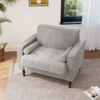 Sillón moderno tapizado de pana con brazos y cojines