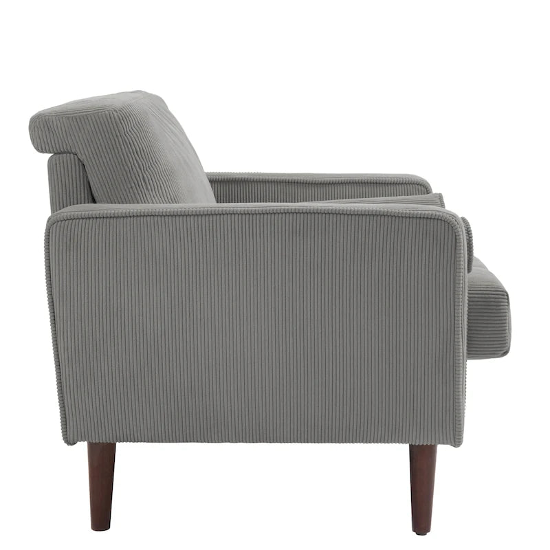 Sillón moderno tapizado de pana con brazos y cojines