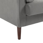 Sillón moderno tapizado de pana con brazos y cojines