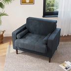 Sillón moderno tapizado de pana con brazos y cojines