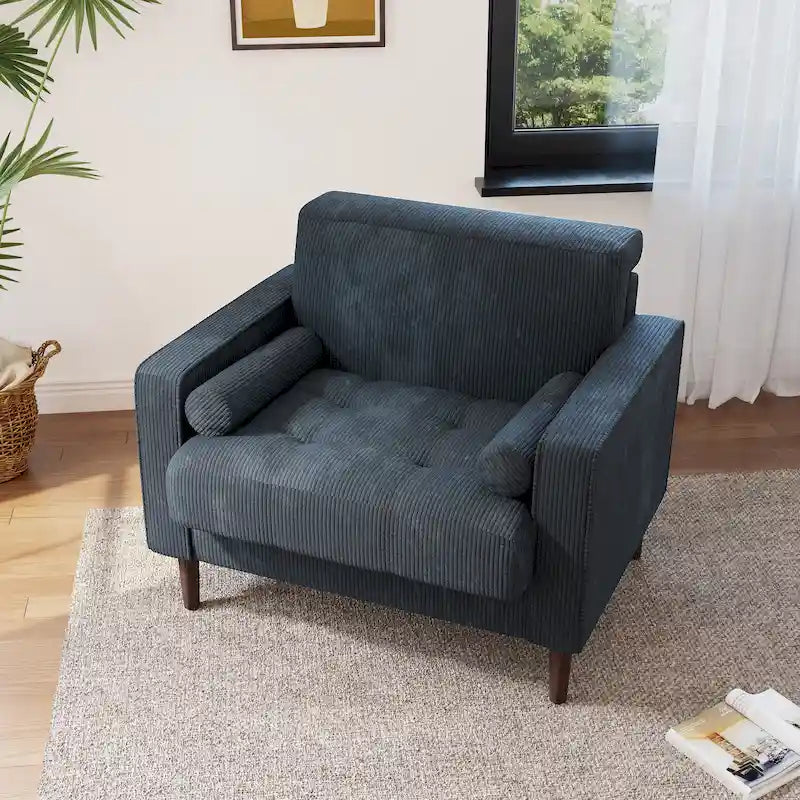 Sillón moderno tapizado de pana con brazos y cojines