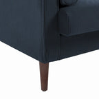 Sillón moderno tapizado de pana con brazos y cojines