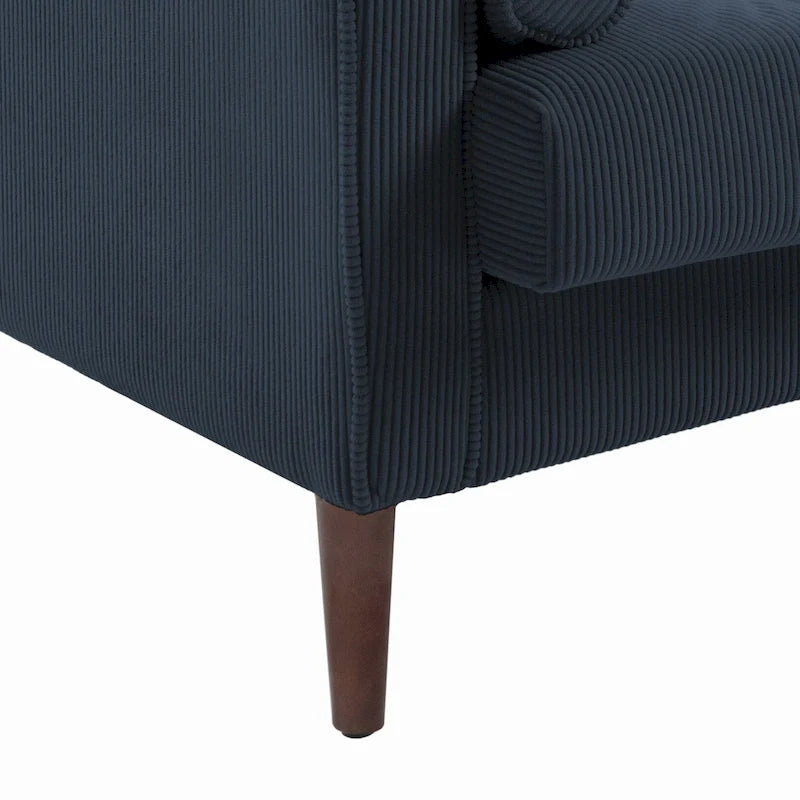 Sillón moderno tapizado de pana con brazos y cojines