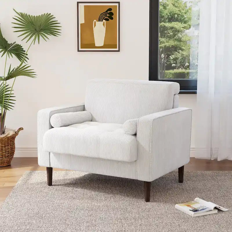 Sillón moderno tapizado de pana con brazos y cojines