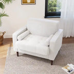 Sillón moderno tapizado de pana con brazos y cojines
