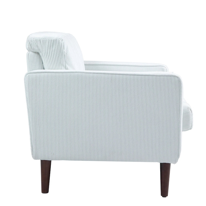 Sillón moderno tapizado de pana con brazos y cojines