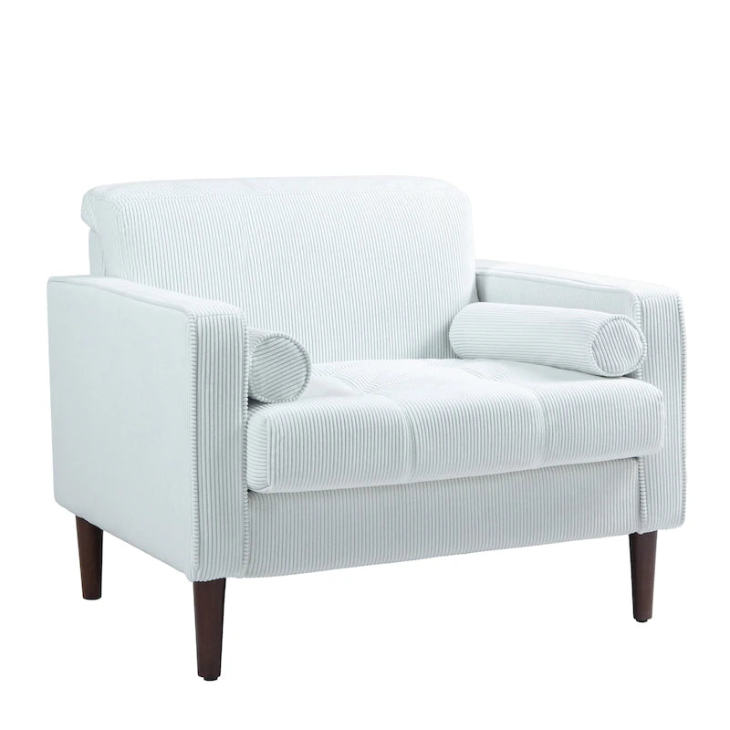 Sillón moderno tapizado de pana con brazos y cojines