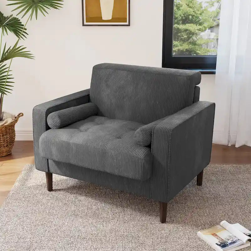 Sillón moderno tapizado de pana con brazos y cojines