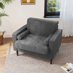 Sillón moderno tapizado de pana con brazos y cojines