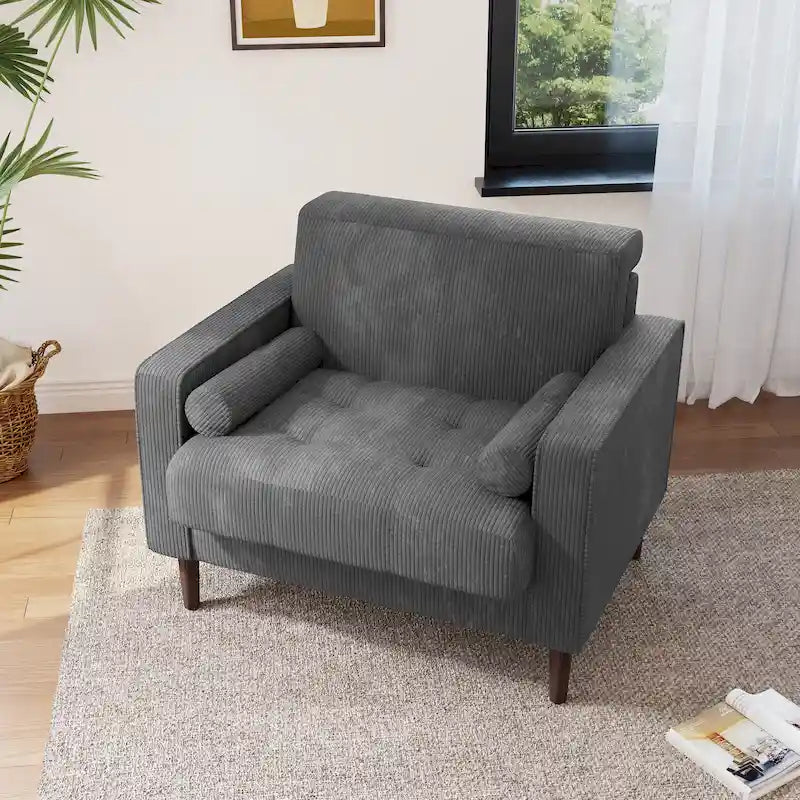 Sillón moderno tapizado de pana con brazos y cojines