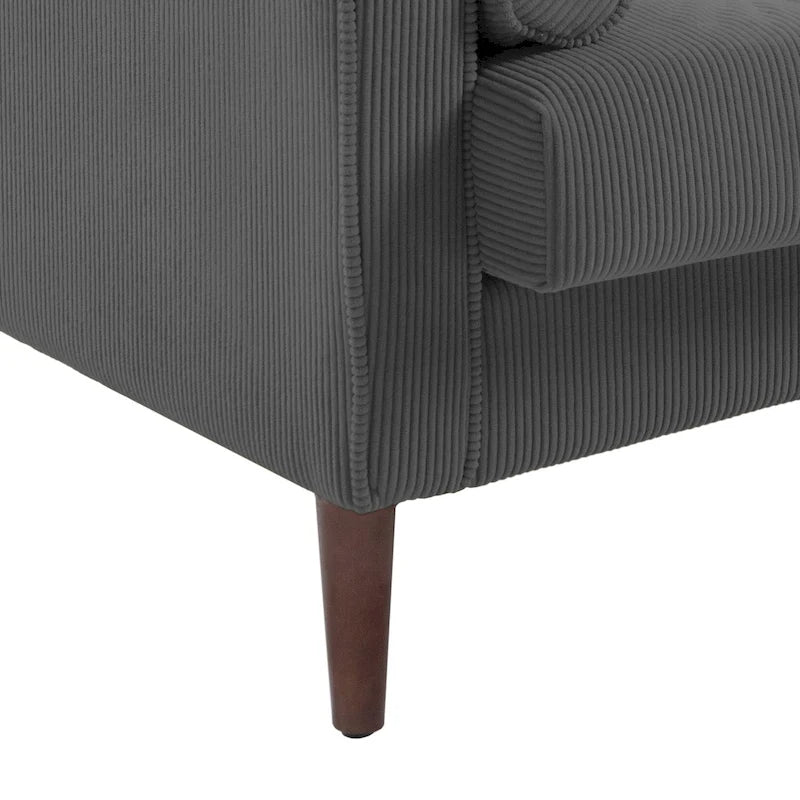 Sillón moderno tapizado de pana con brazos y cojines
