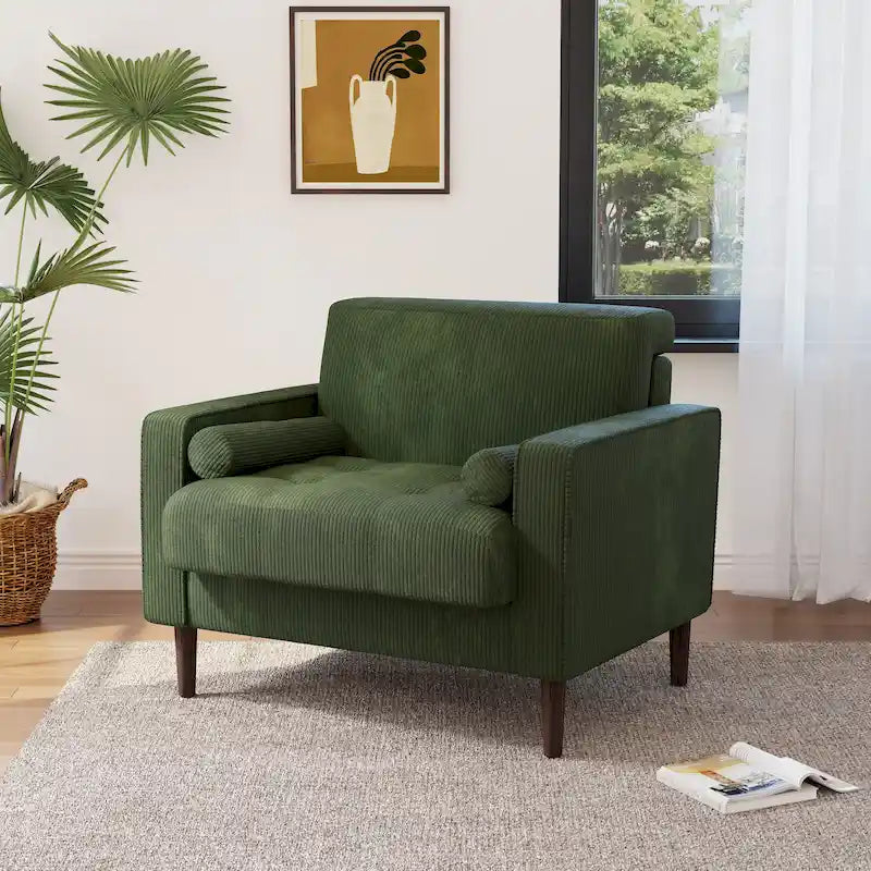 Sillón moderno tapizado de pana con brazos y cojines