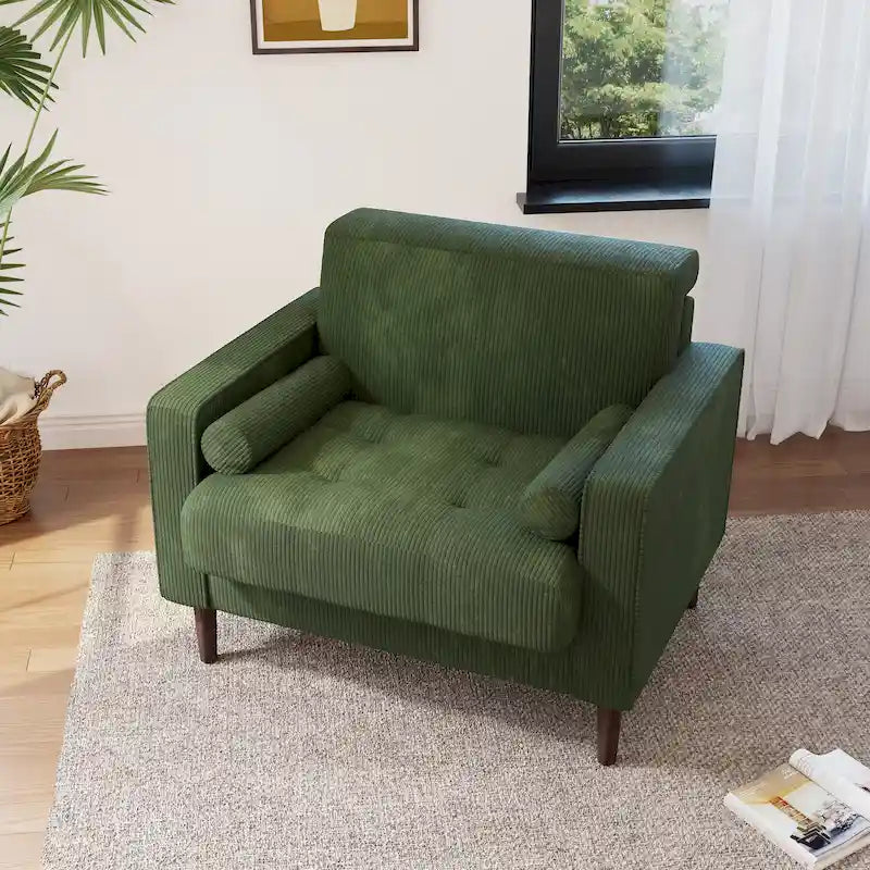 Sillón moderno tapizado de pana con brazos y cojines