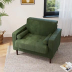Sillón moderno tapizado de pana con brazos y cojines