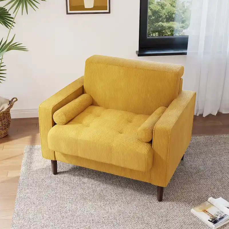 Sillón moderno tapizado de pana con brazos y cojines