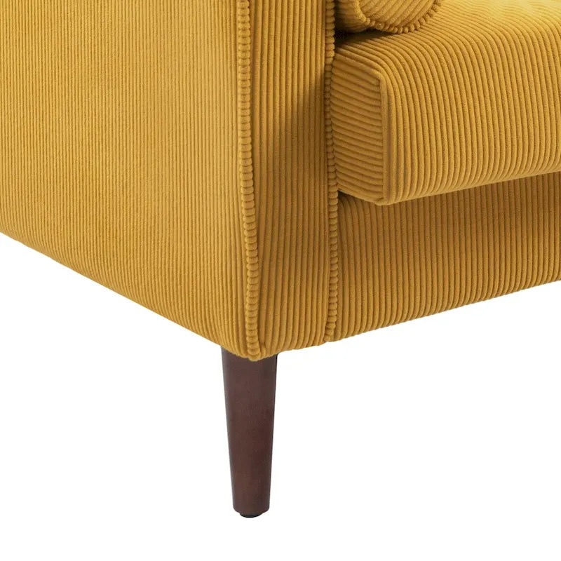 Sillón moderno tapizado de pana con brazos y cojines